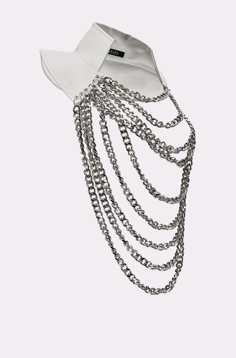 The HEAVY METAL NECKLACE features layered silver chains draped over a white shirt collar, showcased against a plain light background. 4