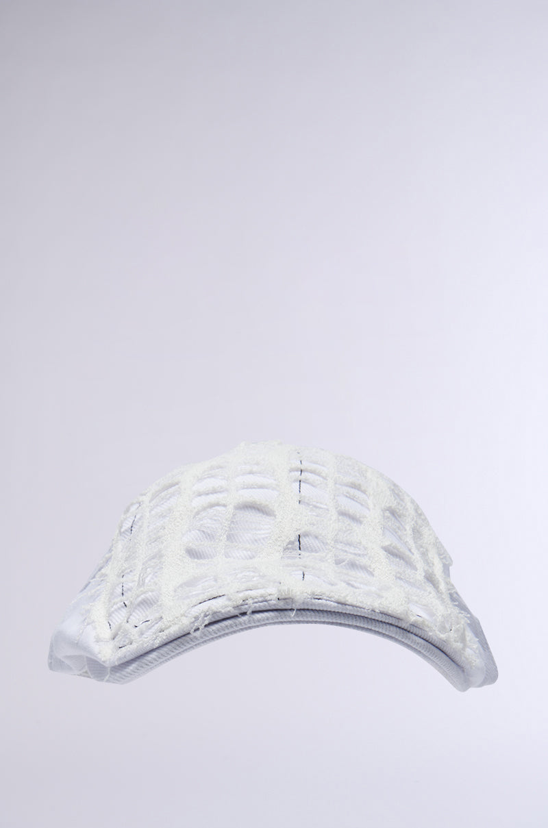 The SPREAD THE NEWS TEXTURED CAP is a white baseball cap with an abstract net-like design creating a textured feel. Its modern, artistic pattern stands out against the neutral gray background, and an adjustable snap button ensures a perfect fit. 2
