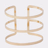 The STRICTLY BUSINESS ARM CUFF features three horizontal bands joined by two vertical bars, forming a sleek open geometric design with a polished gold finish and open back—ideal for elevating any outfit.