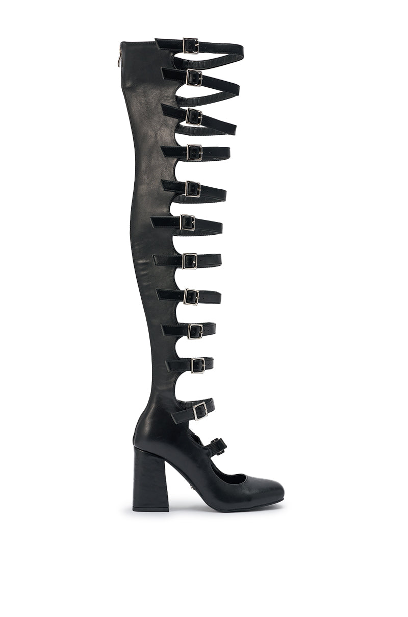 The AKIRA GOLD YVETTE BLACK OVER THE KNEE MARY JANE BOOT is a single black faux leather thigh-high with multiple straps and silver buckles, rounded toe, and chunky block heel for bold style. 6