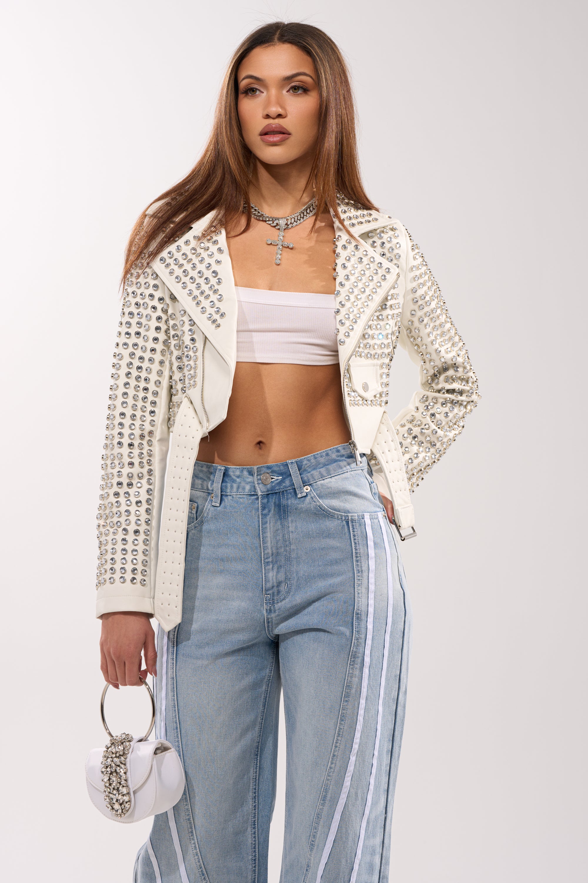 A woman wearing the DEMI EMBELLISHED MOTO IN WHITE.