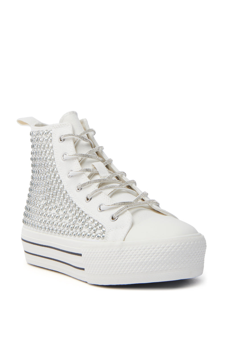 The AZALEA WANG ZAFRINA WHITE HIGH TOP SNEAKER features sparkling rhinestones on the sides, silver laces, and a chunky platform sole with two bold black stripes for standout style.