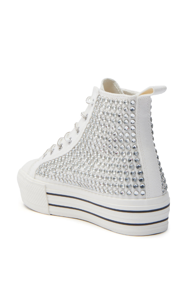 The AZALEA WANG ZAFRINA WHITE HIGH TOP SNEAKER features a thick striped platform sole and dazzling rhinestone accents on the side and back panels for an eye-catching look.