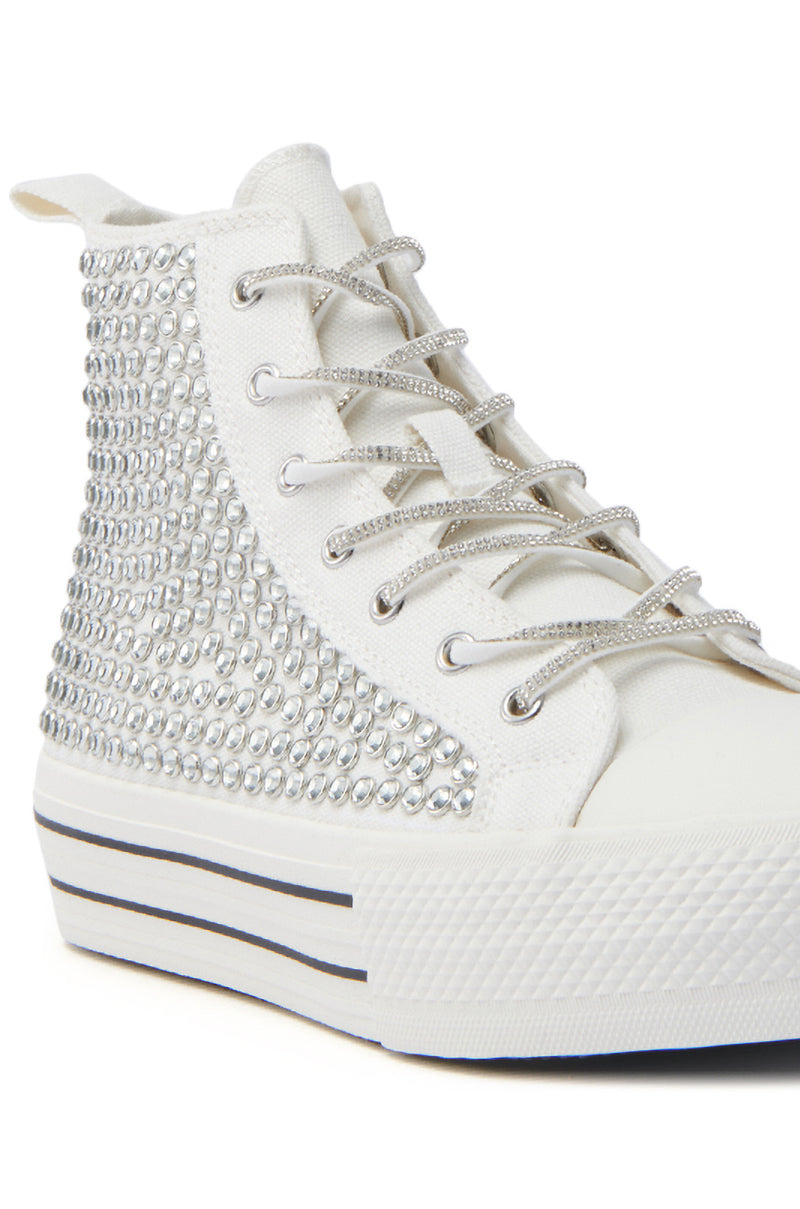 The AZALEA WANG ZAFRINA WHITE HIGH TOP SNEAKER features rhinestone side detailing, metallic silver laces, and a thick platform sole with black stripe accents.