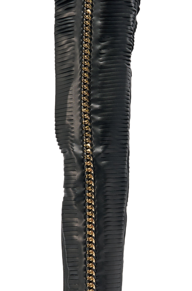 Close-up of the AZALEA WANG ZARIE Black Thigh High Stretch PU Stiletto Boot, featuring textured material and a striking gold zipper down the center. 6