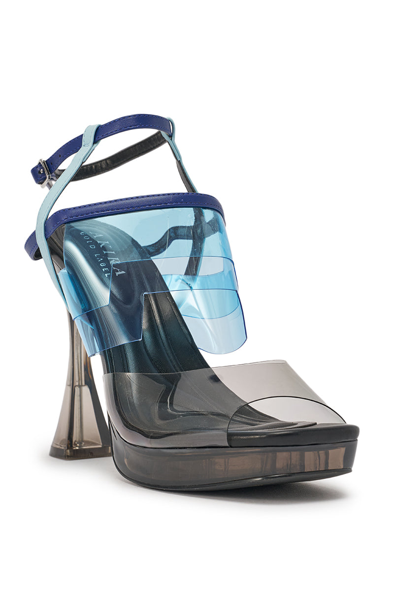 The AKIRA GOLD ZENAE BLUE MULTI PVC CHUNKY SANDAL features blue faux leather, transparent blue and gray straps, a modern sculptural design, open square toe, flared chunky heel, and a chic blue ankle strap. 5
