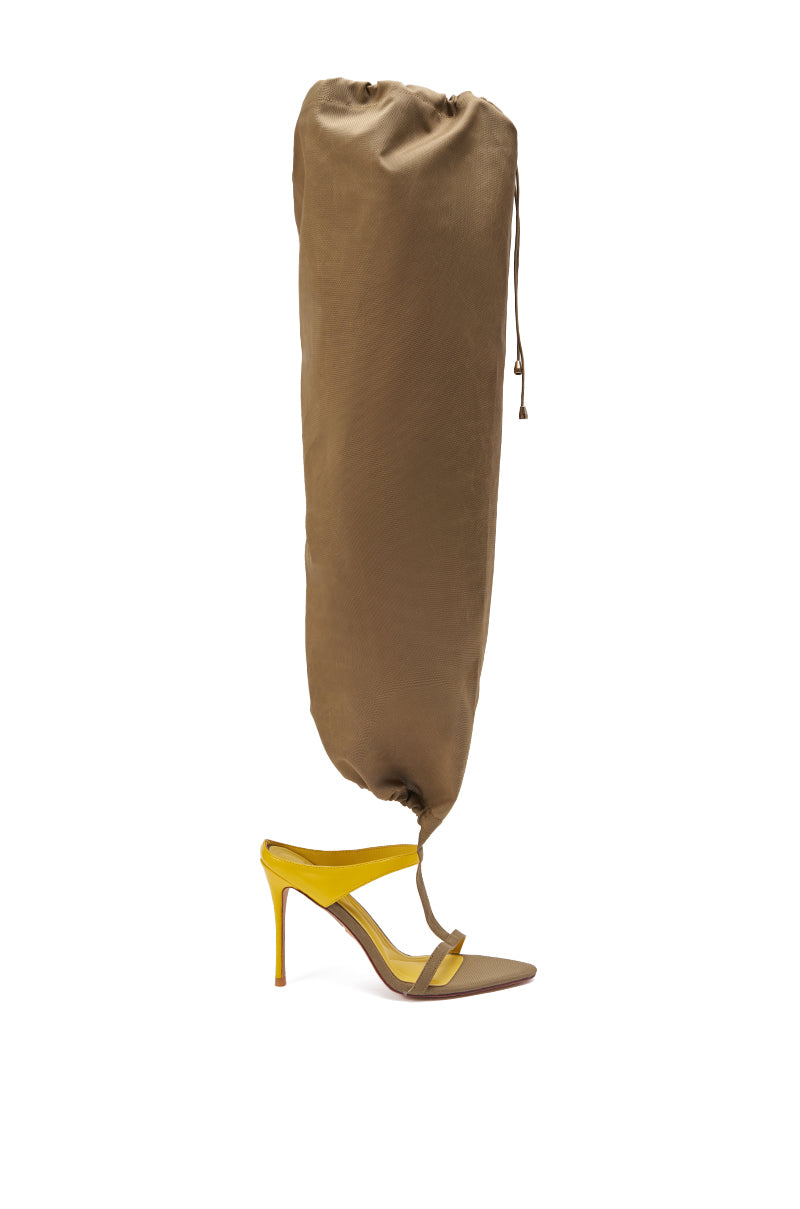 The AKIRA GOLD ZIDANE OLIVE CANVAS SLOUCHY STILETTO SANDAL pairs a high heel with olive canvas slouchy straps, merging streetwear edge and surreal style in a standout fashion piece. 7