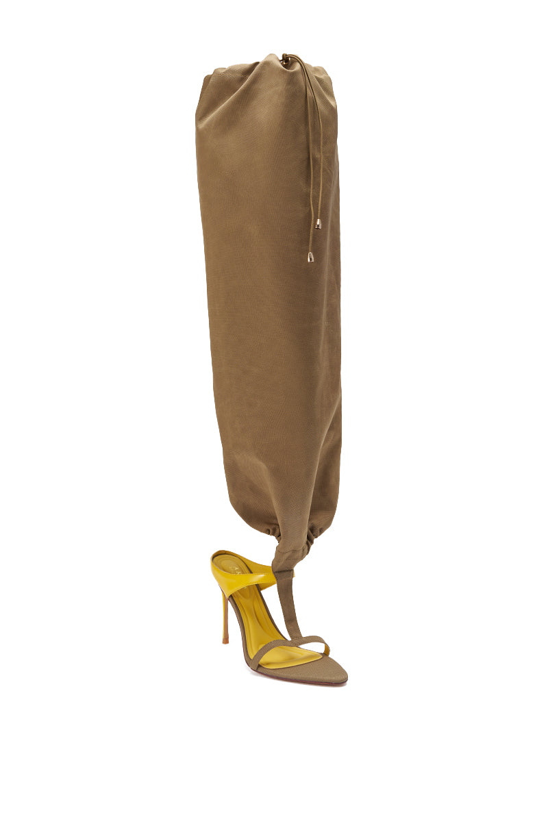 The AKIRA GOLD ZIDANE OLIVE CANVAS SLOUCHY STILETTO SANDAL features slouchy taupe straps, a yellow insole, and an attached brown gaiter that covers up to the knee with a drawstring—perfect for standout streetwear style. 8