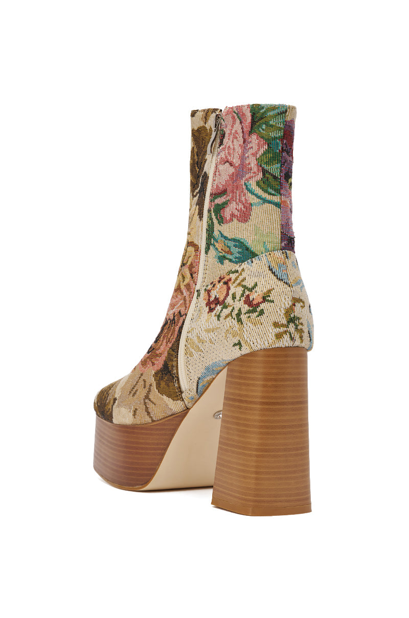 The AZALEA WANG ZILPAH FLORAL BROCADE BOOTIE features a floral pattern, beige zipper, chunky block heel, and high wooden platform—ideal for those seeking standout ankle booties with bold style, shown from a rear side angle. 5
