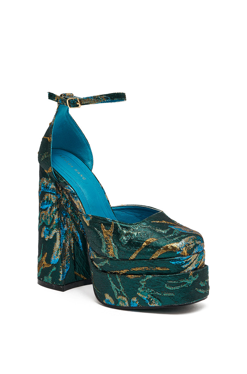 The AZALEA WANG ZIPPHORA BLUE BROCADE CHUNKY PUMP showcases a vintage look with blue and green floral patterns, platform heel, ankle strap, chunky design, and a bright blue insole.