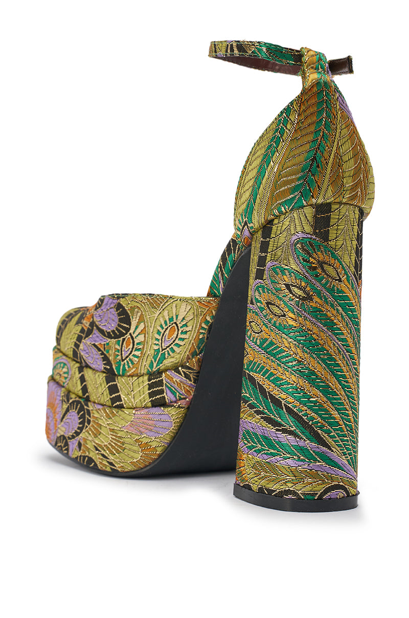 The AZALEA WANG ZIPPHORA GREEN MULTI BROCADE PLATFORM PUMP features a chunky block heel, ankle strap, cushioned insole, and gold, green, and purple peacock feather embroidery on vibrant brocade fabric. 10