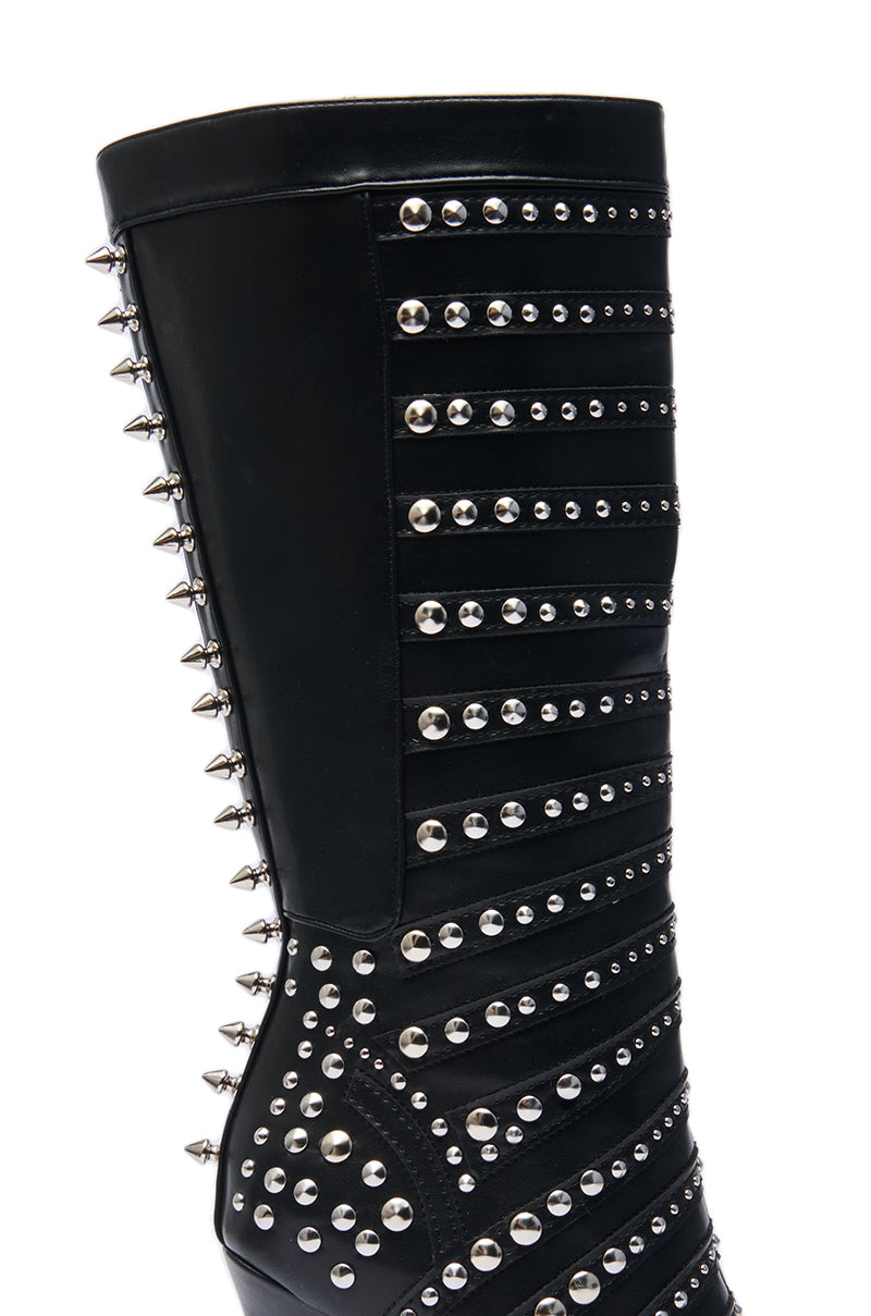 A close-up of the AZALEA WANG ZOX Black Rhinestone and Studded Black Bootie, featuring a modern, edgy design with multiple rows of silver studs and rhinestones arranged in dynamic patterns.