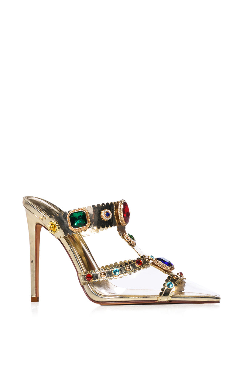 The AZALEA WANG ZYA MULTI GOLD EMBELLISHED PVC PUMP features large colorful gemstone decorations on its two-strapped gold high-heeled sandal design, with a slim stiletto heel adding elegance.