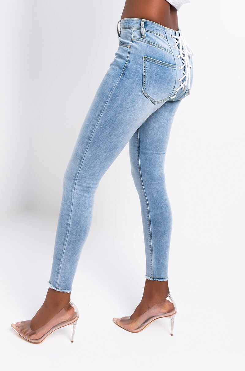 Side View All Over Lace Up Back Skinny Jeans in Light Blue Denim