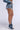 Side View Automatic Distressed Denim Chain Detail Mini Short