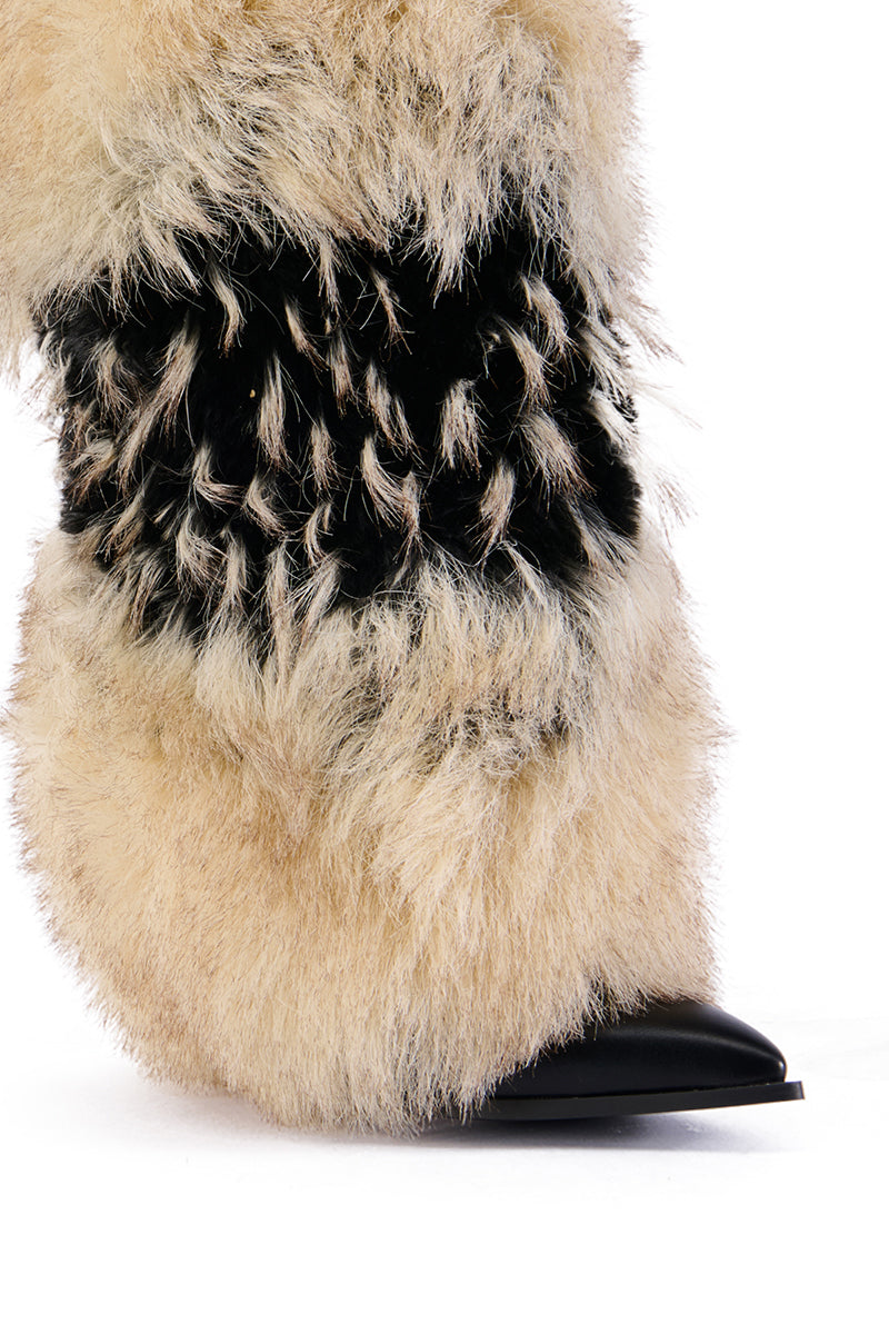 Close-up of an AZALEA WANG EKKO MULTI FUR STILETTO BOOT with beige faux fur and a contrasting dark fur band, featuring a pointed black faux leather toe against a white background.
