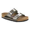 The SEXY CASUAL FLAT is a metallic silver Birkenstock sandal featuring two adjustable buckle straps, a contoured cork footbed with a tan finish, and a black sole with textured grip.