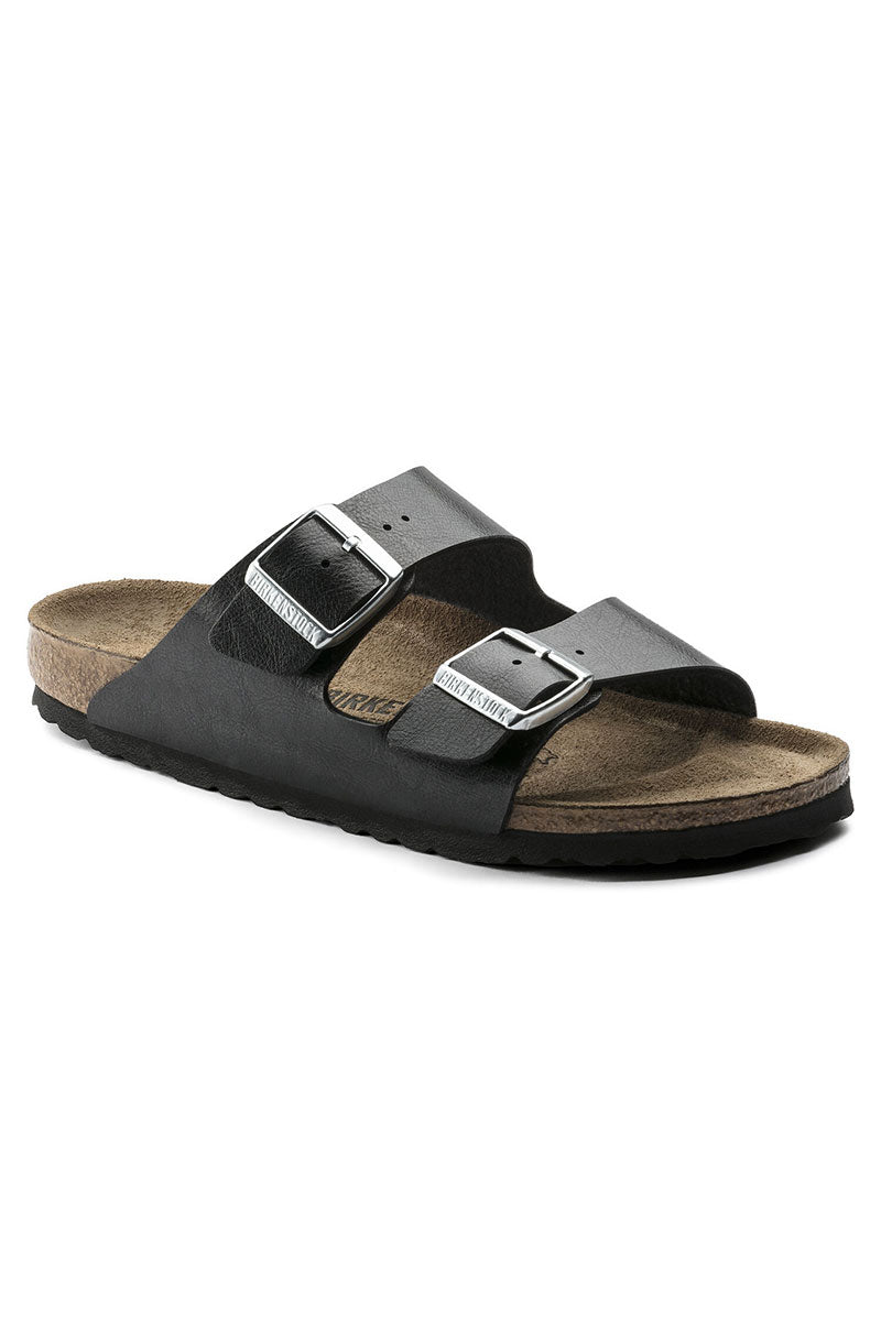 The SEXY CASUAL FLAT is a black sandal by Birkenstock, featuring two adjustable straps with metal buckles. It comes equipped with a contoured cork footbed and a textured rubber outsole for added comfort and durability.