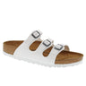 The BIRKENSTOCK FLORIDA BF WHITE sandal features a contoured cork footbed and a white rubber sole. It boasts three adjustable white straps across the top, each equipped with a silver buckle for customized comfort.