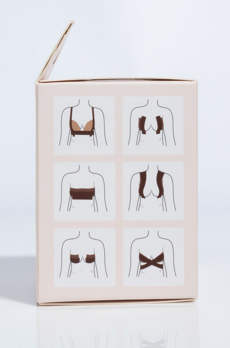 A rectangular box labeled "BODY TAPE BEIGE" features simple illustrations in brown and black, showing six different torso outlines that demonstrate various bra fastening and strap configurations.