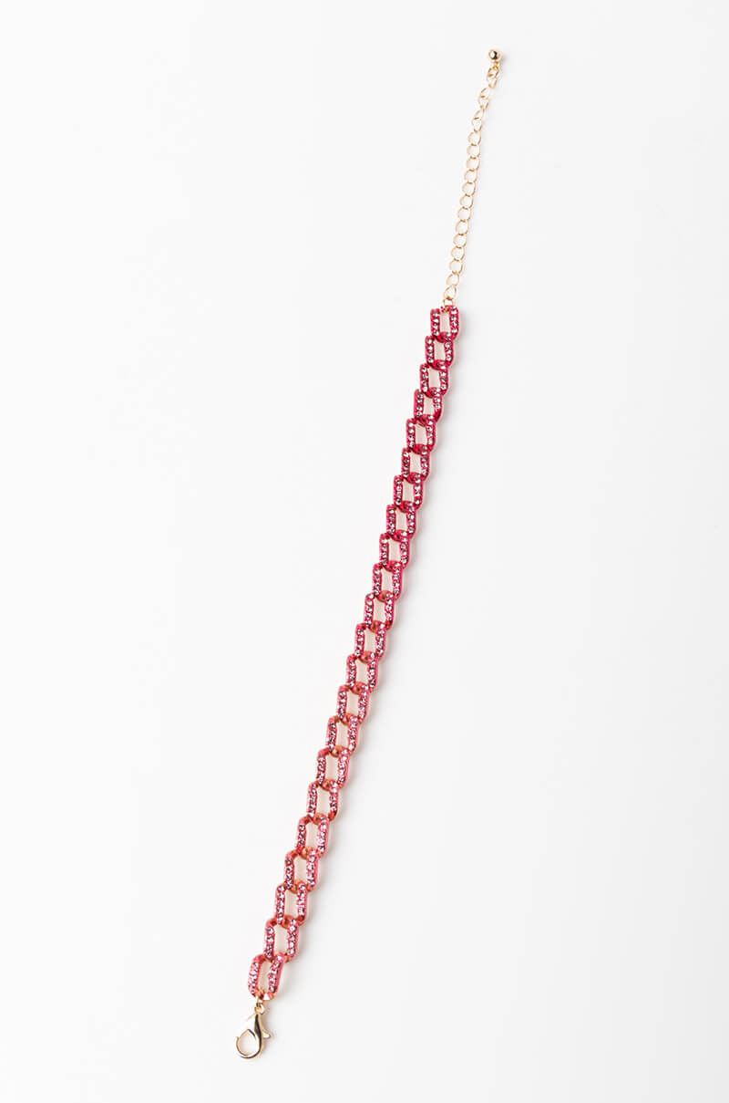 Introducing the BRACELET - a delicate accessory featuring interlinked pink rectangular beads arranged in an elegant diagonal pattern. The design transitions seamlessly into a golden chain, complete with an adjustable closure clasp at one end. The bracelet is beautifully showcased laid flat on a white surface.
