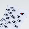 The CHAMPION P1 ALL OVER C CREW WITH EMBROIDERY is a pair of white socks adorned with a repeating black logo pattern. One sock features the logo in black accented with red. The socks are displayed flat on a plain background.