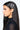 A woman with long, sleek black hair is shown in profile against a plain white background, wearing a black turtleneck top. Her hair is adorned with the DAMN FEELINGS HAIR CLIP SET, featuring two silver hairpins that read "DAMN" and "FEELINGS." She has winged eyeliner and a calm expression.