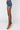 Side View Extreme Stretch High Waisted Jean Shorts in Medium Blue Denim