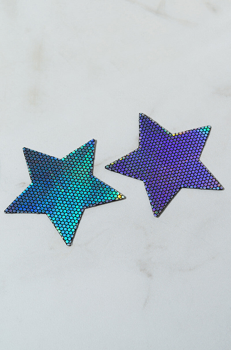 Product LP-STR-NS features two star-shaped patches with a holographic, scale-like texture that transitions in color from green to blue to purple, set against a light marble-like background.