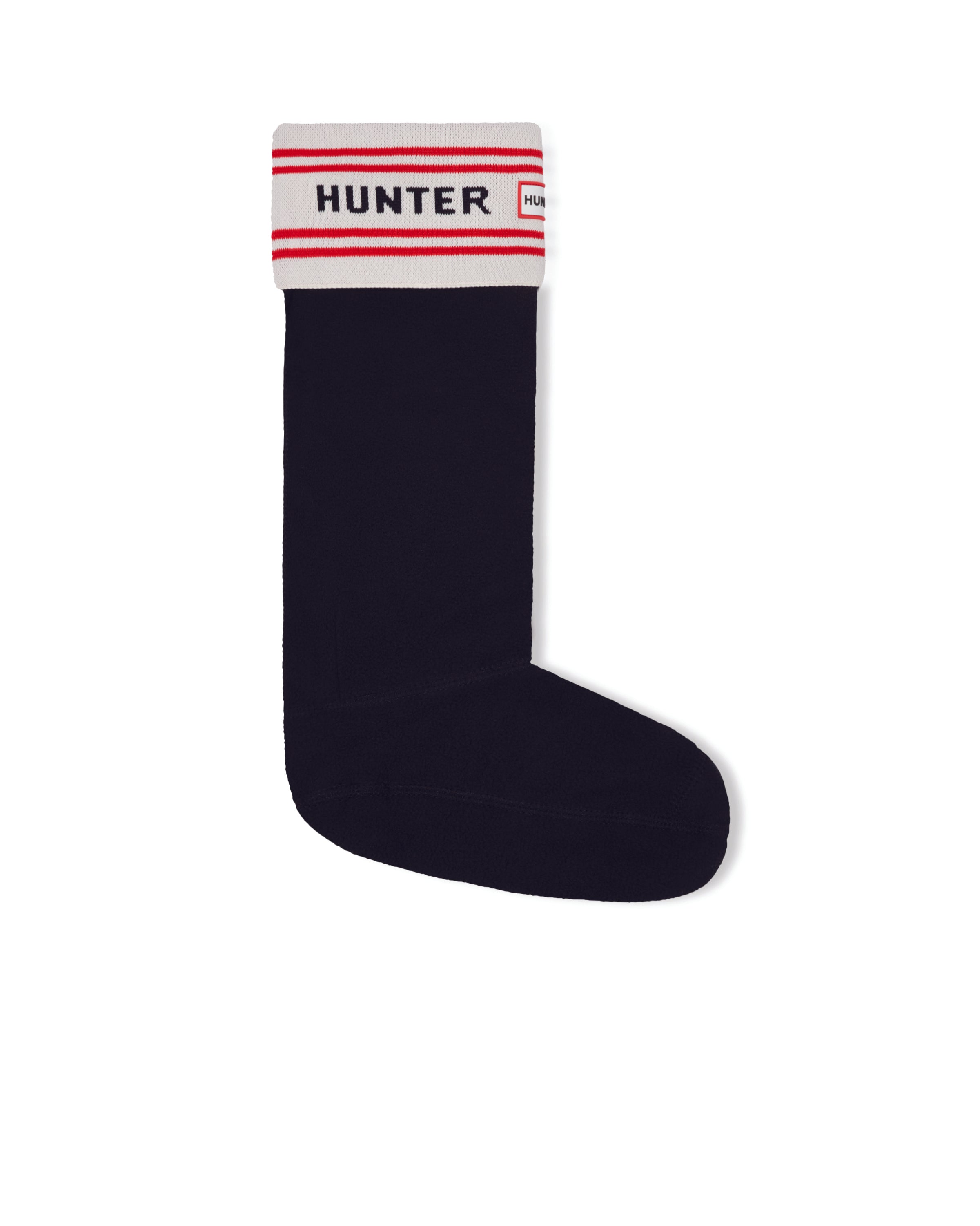 The HUNTER BRANDED KNITTED CUFF BOOT SOCK is a single black knee-high sock featuring a cuff at the top adorned with white, red, and black stripes. The cuff prominently displays "HUNTER" in bold red letters on a white background.