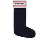 The HUNTER BRANDED KNITTED CUFF BOOT SOCK is a single black knee-high sock featuring a cuff at the top adorned with white, red, and black stripes. The cuff prominently displays "HUNTER" in bold red letters on a white background.