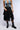 Front View Lyra Asymmetrical Faux Leather Midi Skirt