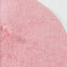 Close-up of the MACAROON BERET HAT PINK showcasing its textured surface. The wool appears soft and fuzzy.