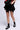 Front View Micah Flounce Mini Skirt In Black