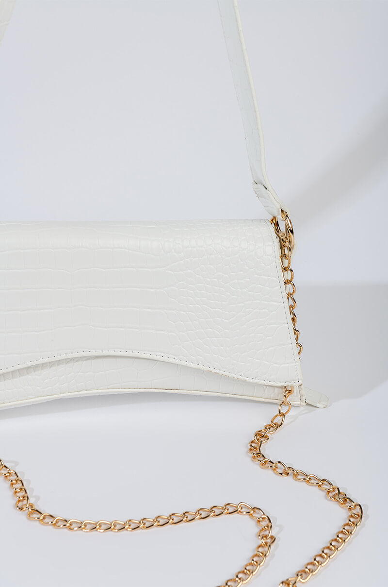 Detail View Moving On Up Bat Wing Purse
