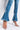 Detail View Nouveau Again High Waisted Flare Jeans in Medium Blue Denim