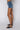 Side View Opposite Direction High Waisted Denim Shorts in Medium Blue Denim