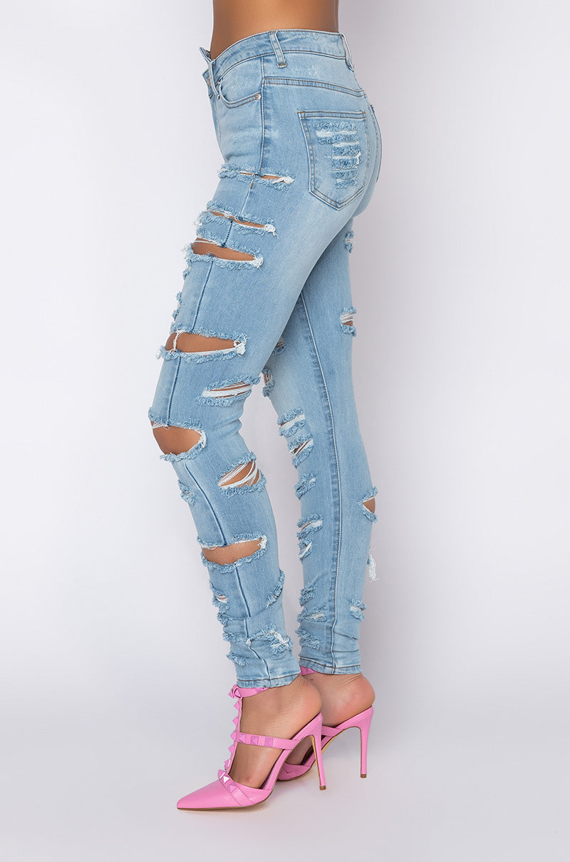 Side View Opposite Direction High Waisted Distressed Skinny Jeans in Light Blue Denim 1