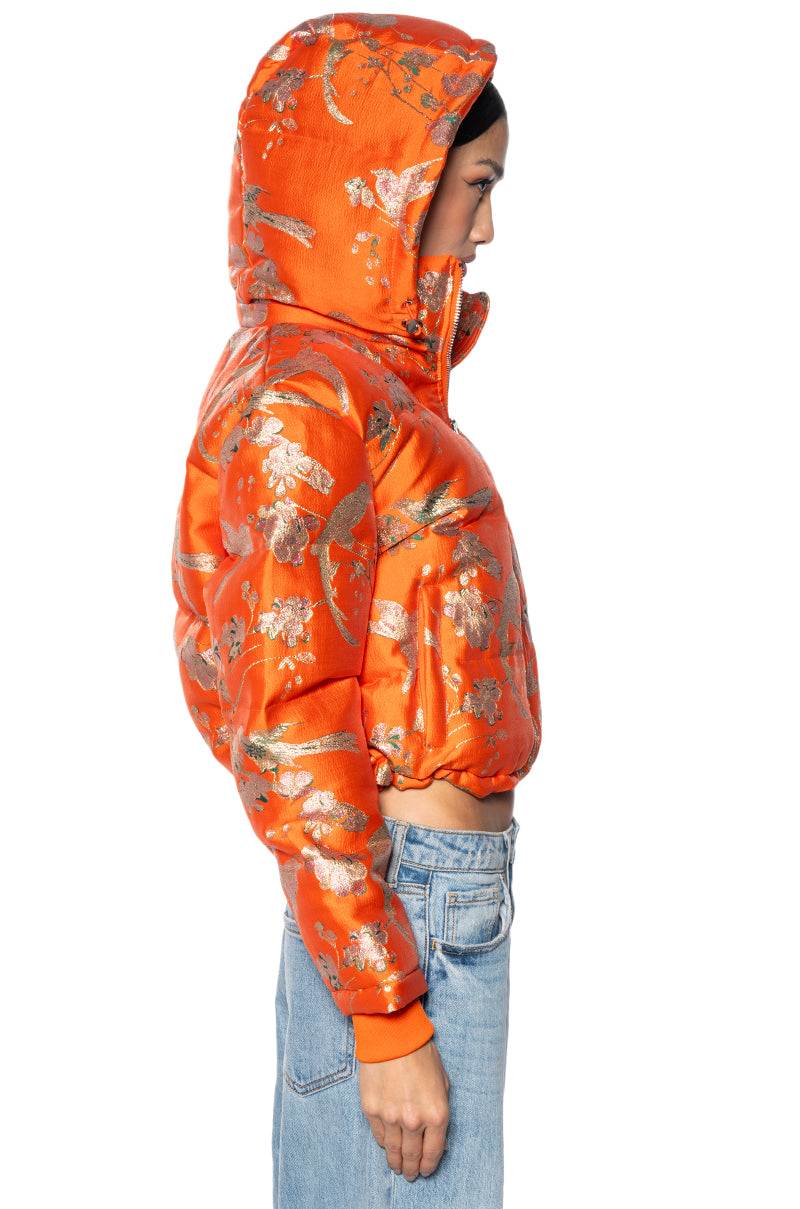 Detail View Orangey Brocade Puffer With Removable Hood