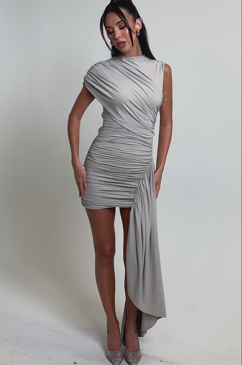 A video of a woman in the WRAP ME UP MINI DRESS IN GREY.