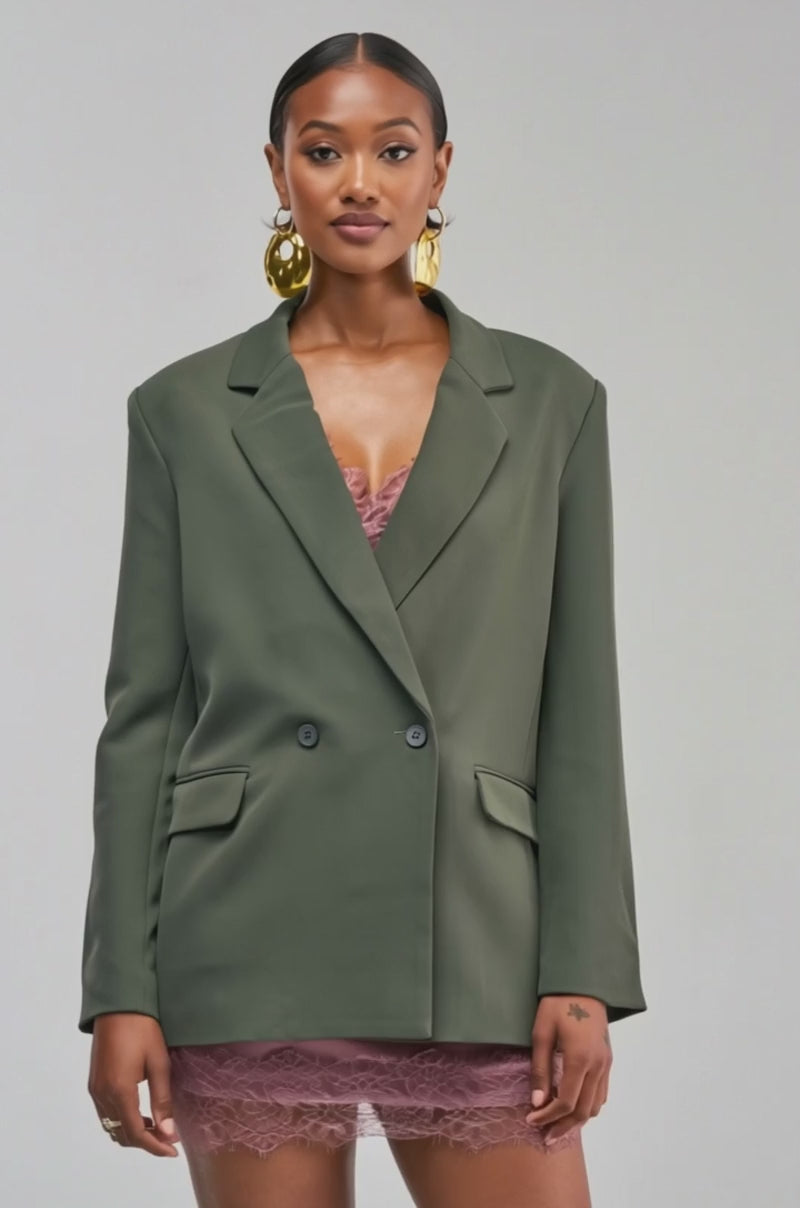 Video of a woman modeling the LOVE ME NOT BOYFRIEND BLAZER in oversized olive green.