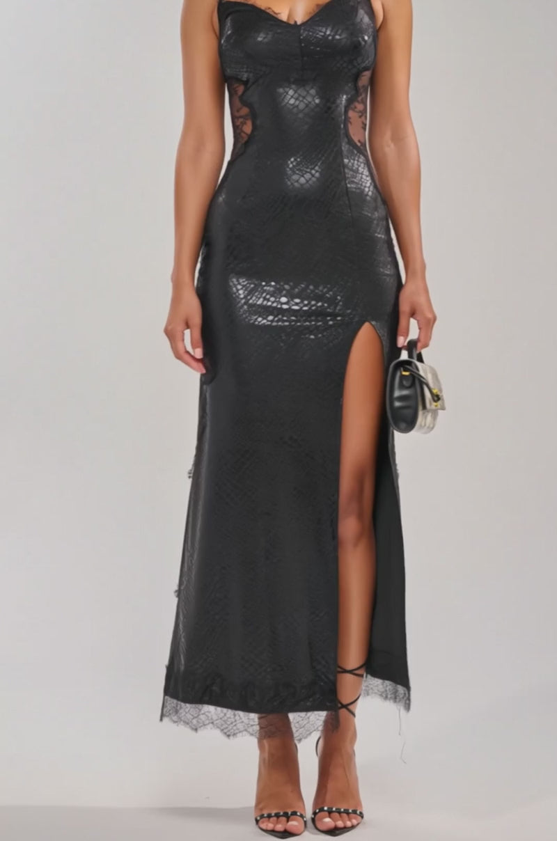 Video of woman modeling the MISS YOU MORE MESH MAXI DRESS IN BLACK, featuring thin straps, sheer lace panels, and a thigh-high slit. 
