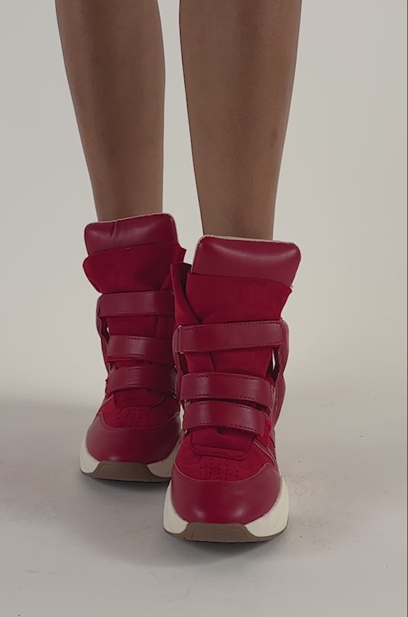 Video of a woman modeling the MARANTO RED WEDGE SNEAKERS—bright red faux suede high-tops with chunky white soles.