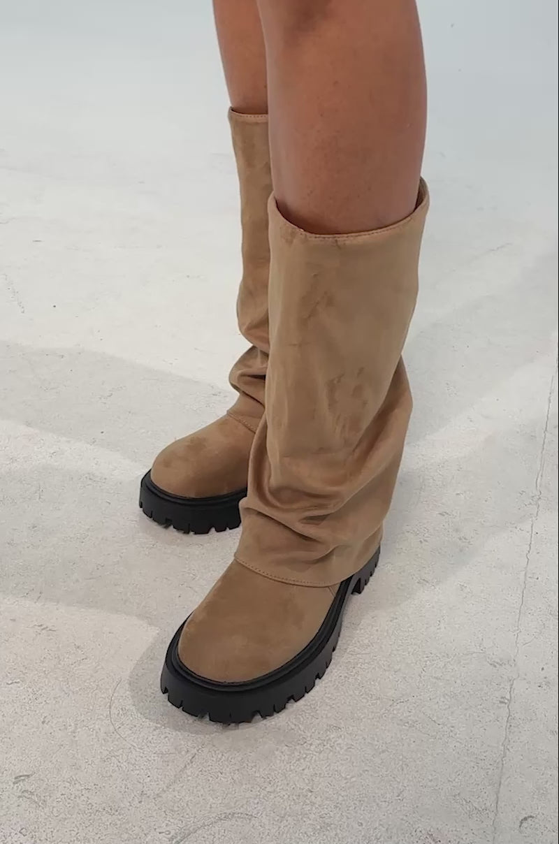 Video of woman modeling the AZALEA WANG HOYT BEIGE FLAT RUCHED BOOTIE—beige faux suede boots with a foldover shaft and chunky platform lug soles