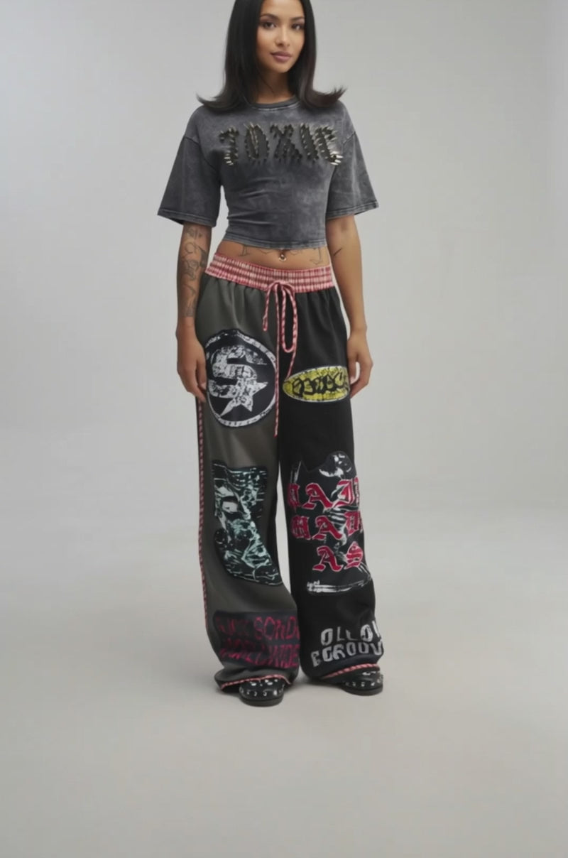 Video of a woman modeling the TRUST NO ONE JOGGER.