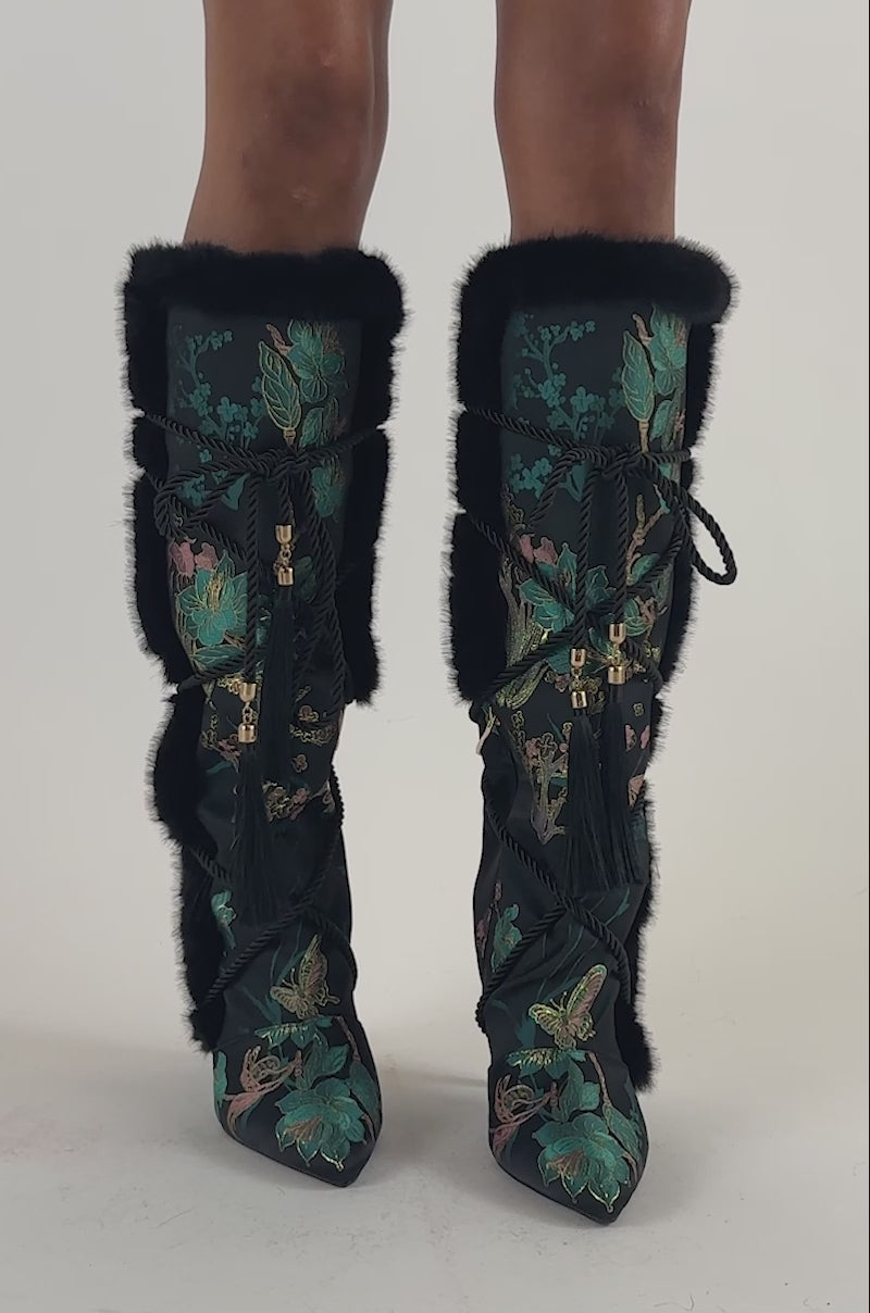 Video of a woman modeling the AZALEA WANG LISBETH BLACK MULTI BROCADE AND FUR STILETTO BOOT.