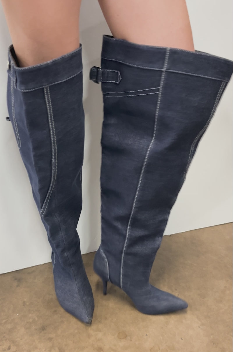 Video of person modeling the AZALEA WANG DUSTAN DENIM THIGH STILETTO BOOT, featuring dark blue denim, a pointed toe, and stiletto heel.