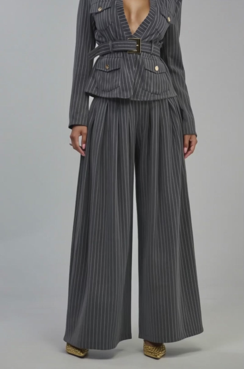 Video of a woman modeling the ROBYN WIDE LEG PINSTRIPE TROUSER.