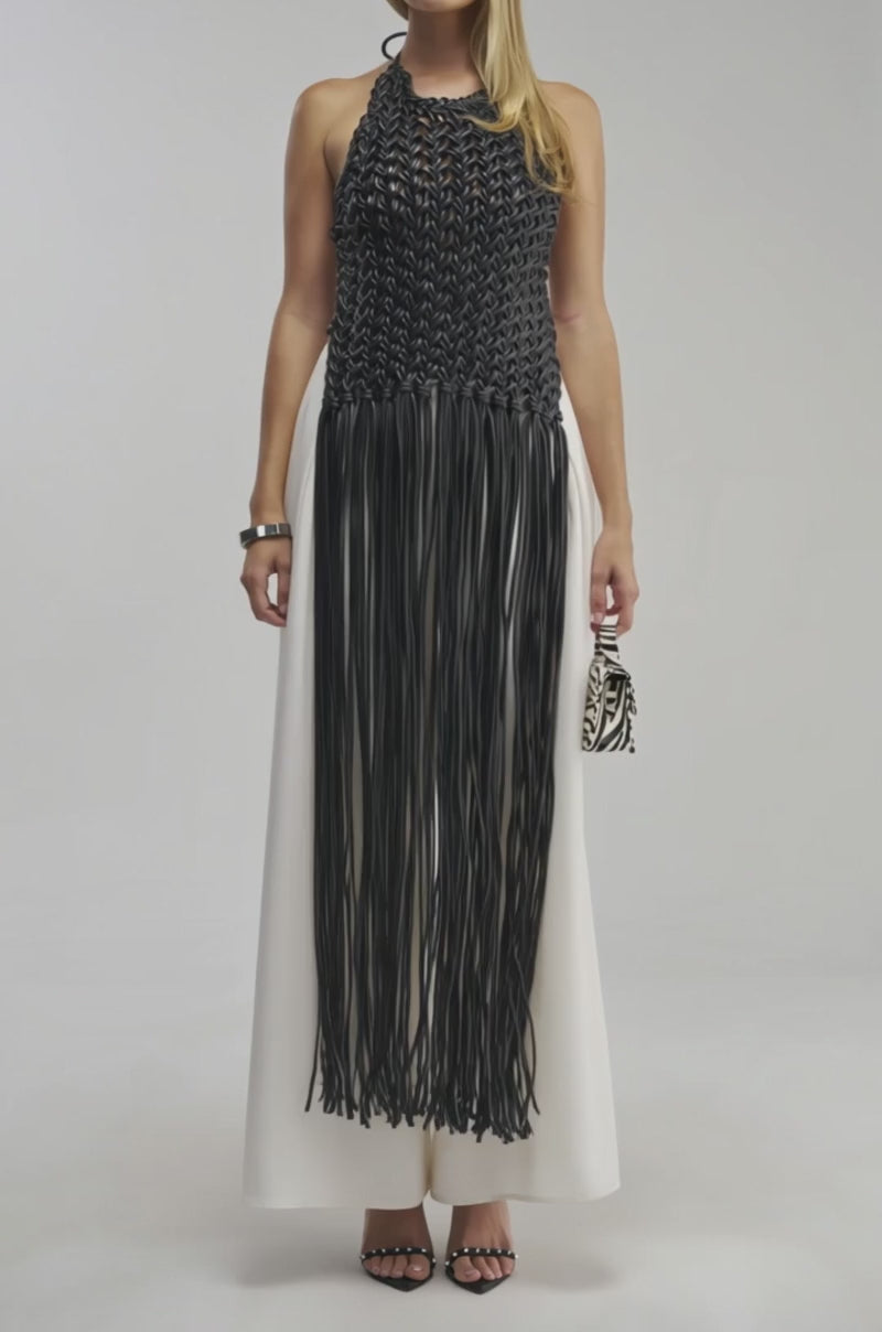 Video of a woman modeling the SHES EVERYTHING PU BRAIDED TOP.
