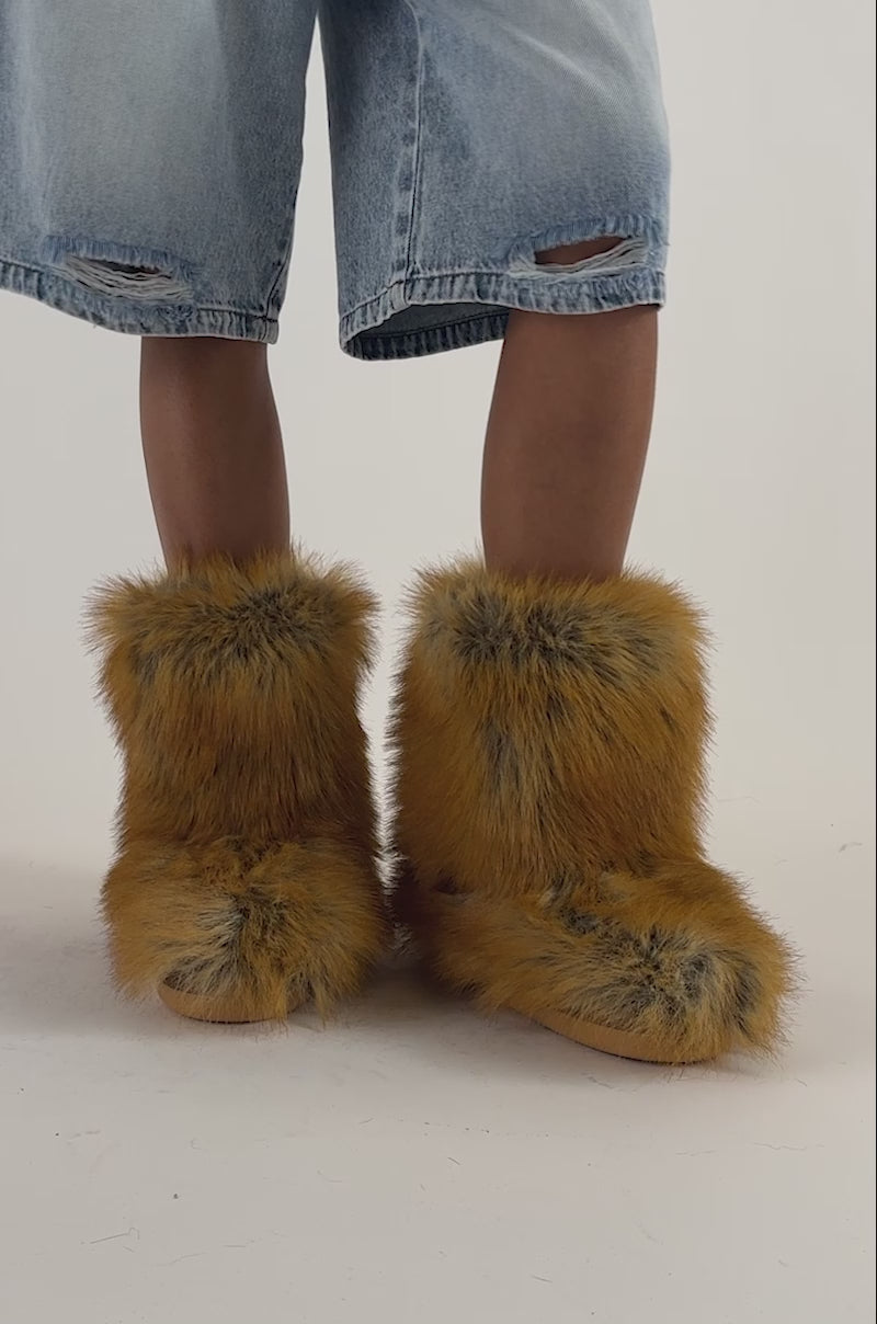 Video of a woman modeling the AZALEA WANG NADIANNA TAN FLAT FUR BOOTIE.